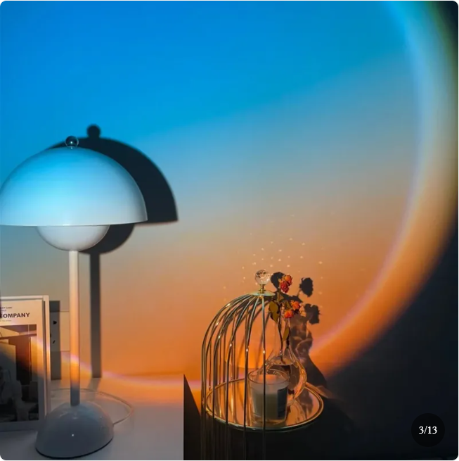 Warm sunset light washing across a styled shelf and decor